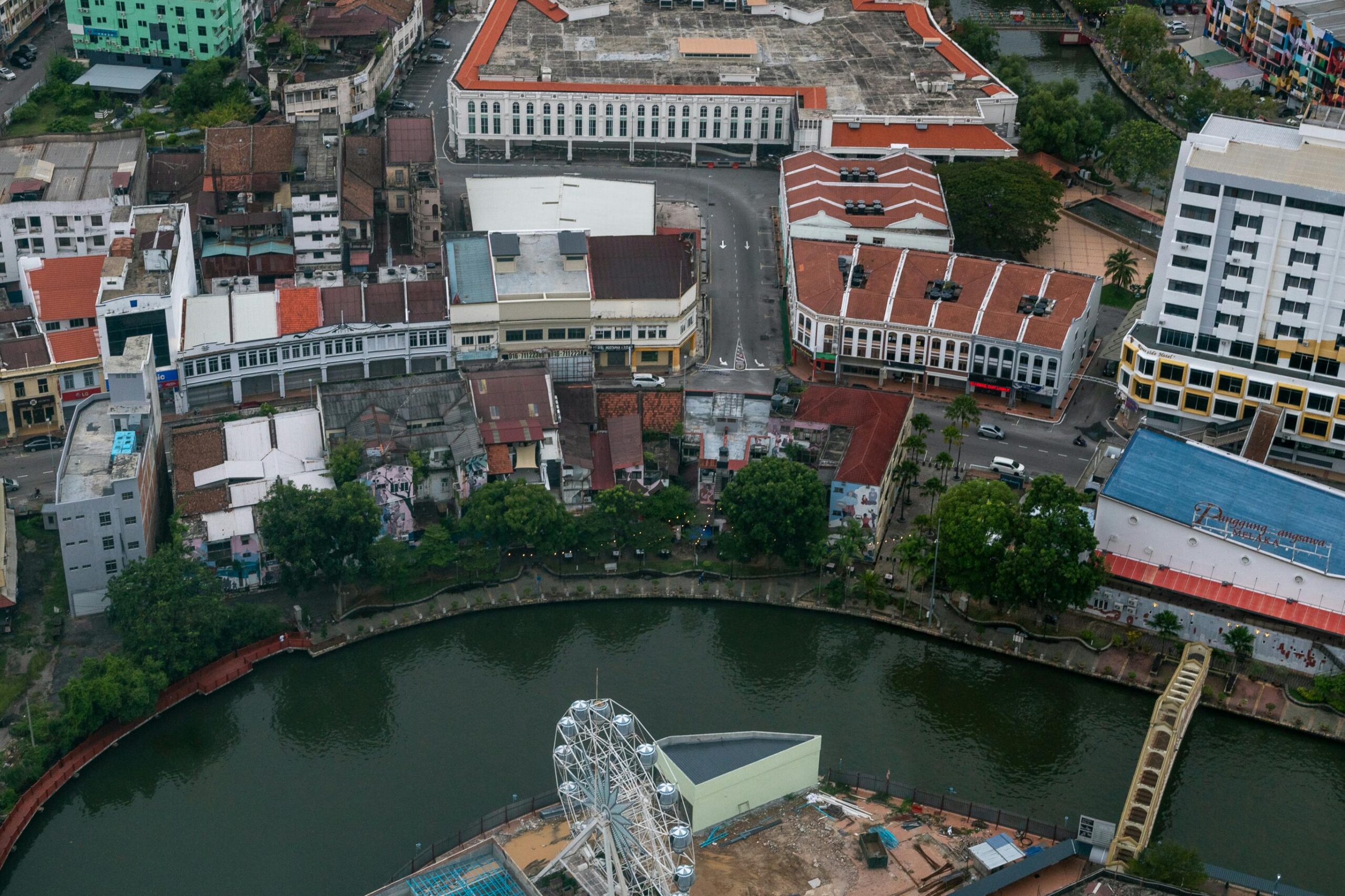 Aerial shot of Malacca city showcasing historic buildings and riverfront.