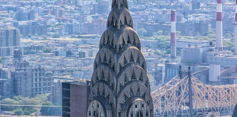Iconic view of the Chrysler Building amidst New York City skyscrapers.