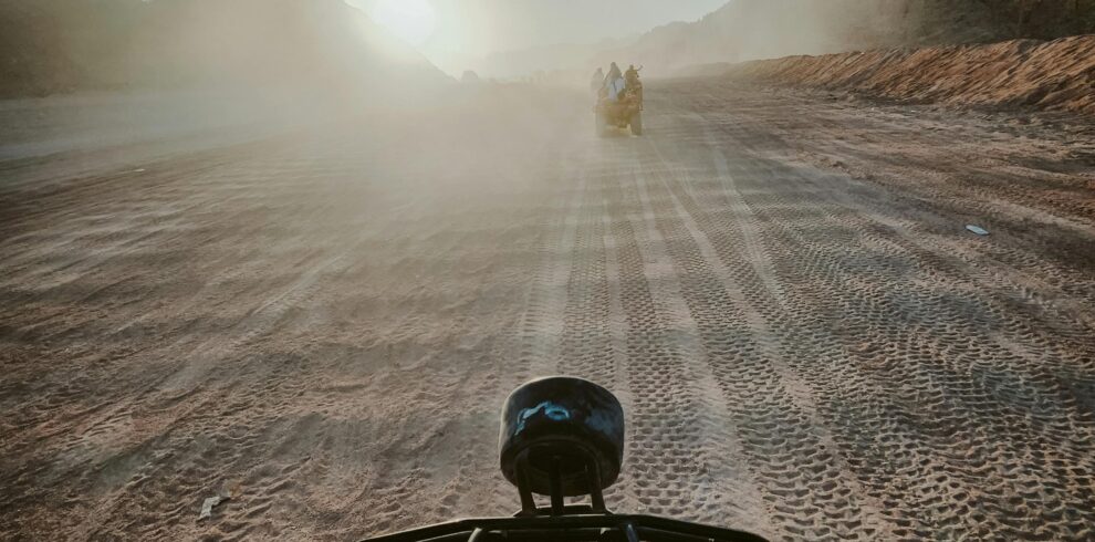 Explore the excitement of an ATV ride through the desert dunes of Sharm El-Sheikh at sunrise.