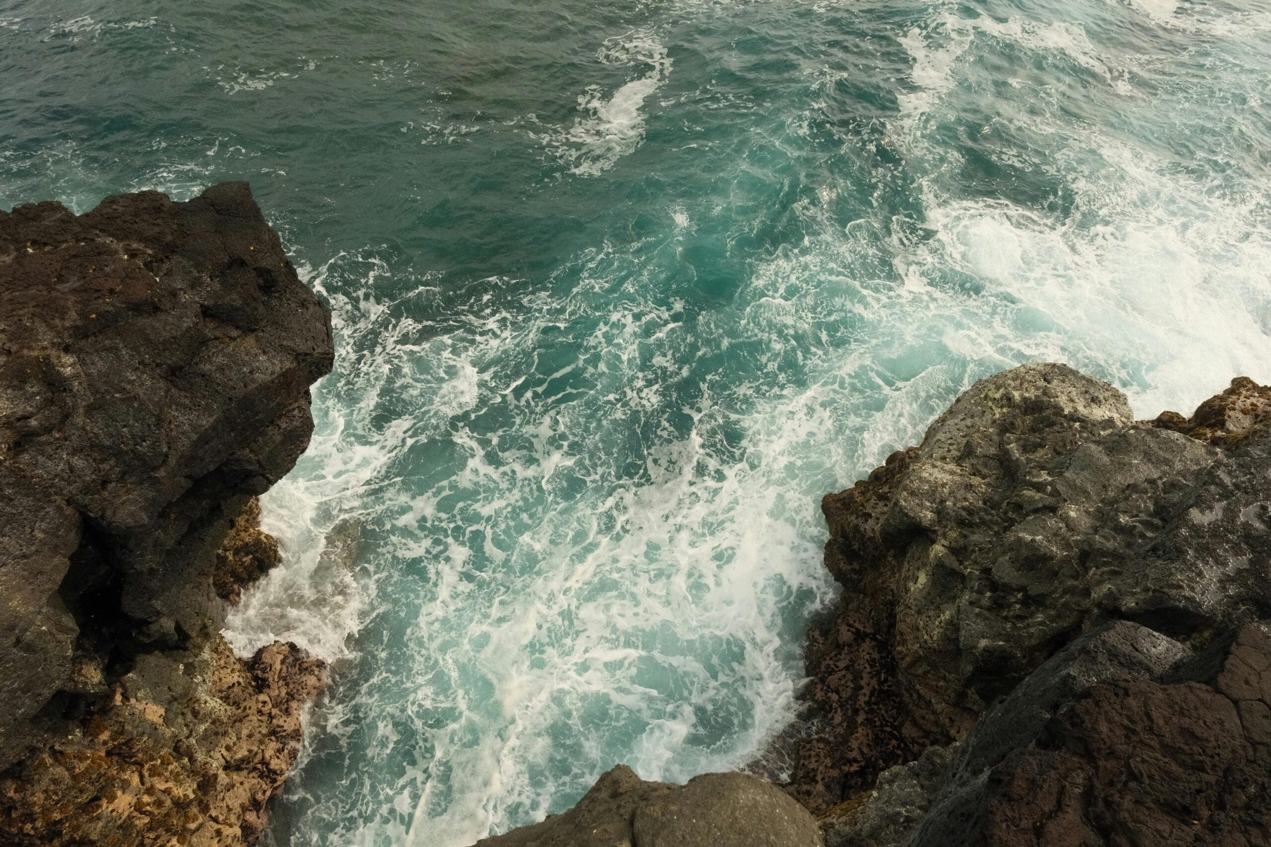 Captivating view of waves crashing against cliffs in Souillac, Mauritius, highlighting natural beauty.