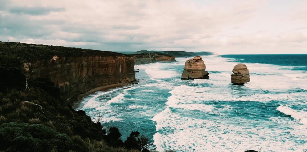 Majestic coastal landscape showcasing the rugged cliffs and ocean waves of the Twelve Apostles.
