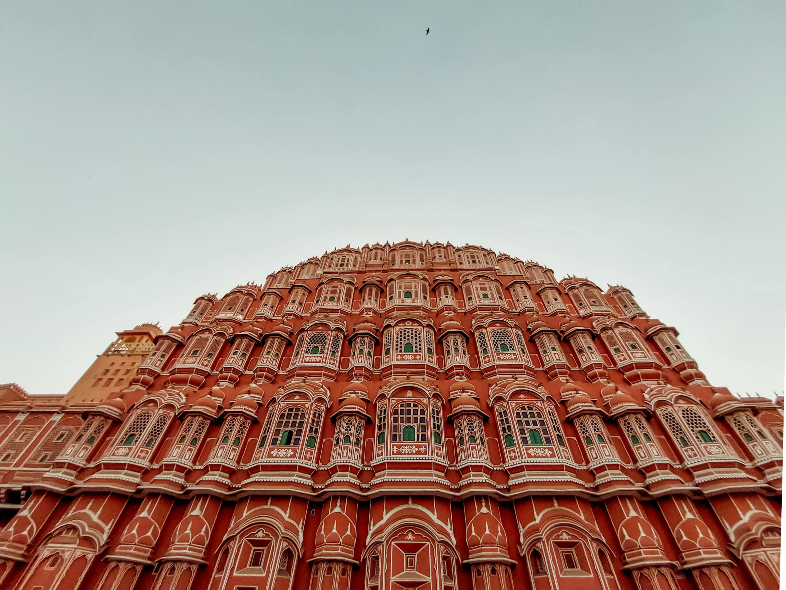Low angle view of iconic Hawa Mahal facade in Jaipur, India. Captivating architectural marvel.