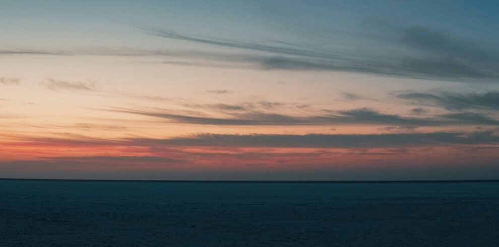 Breathtaking sunset view over the Rann of Kutch, capturing the tranquil dusk sky.
