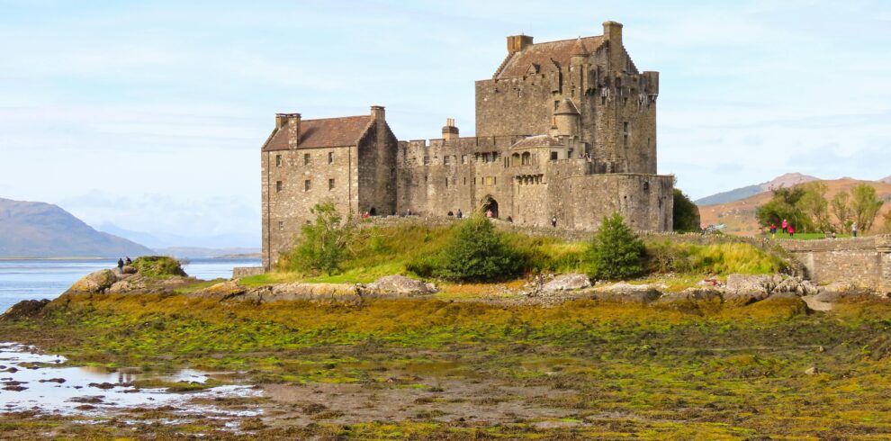 Eilean Donan Castle surrounded by stunning Scottish scenery, a perfect travel destination.