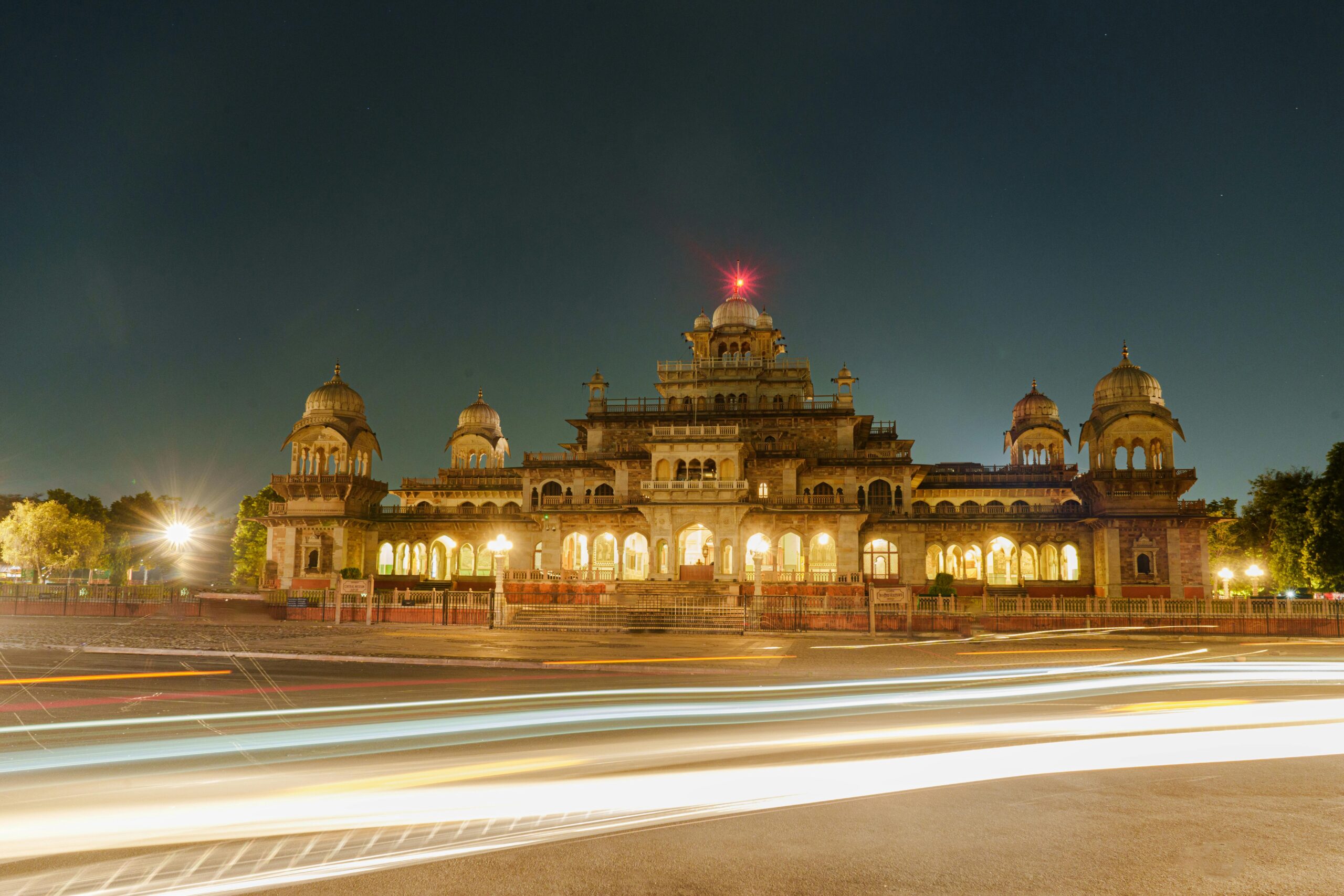 Nighttime long exposure of Albert Hall Museum, Jaipur with light trails.