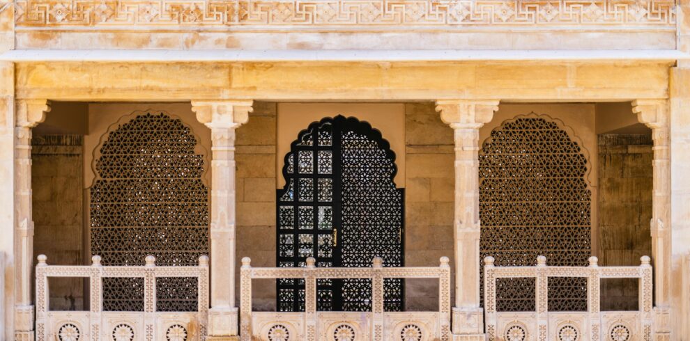 Beautifully carved stone arches and facades showcasing traditional Jaisalmer architecture.